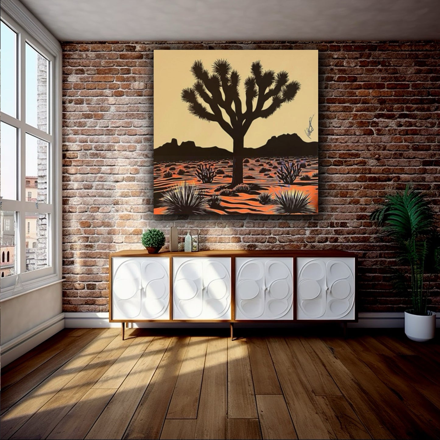 Room interior with a large desert landscape painting on a brick wall.