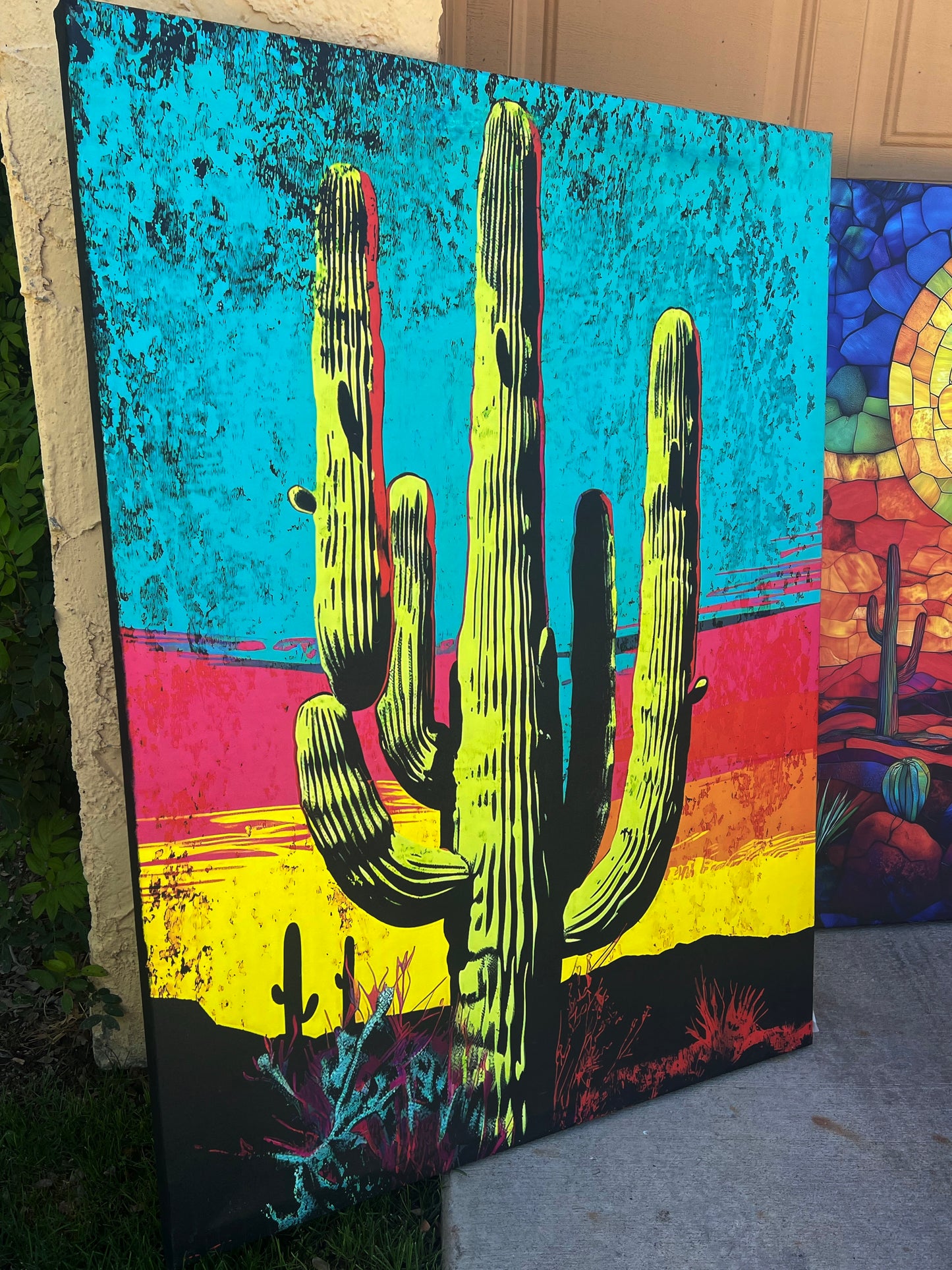Colorful cactus artwork on a textured surface